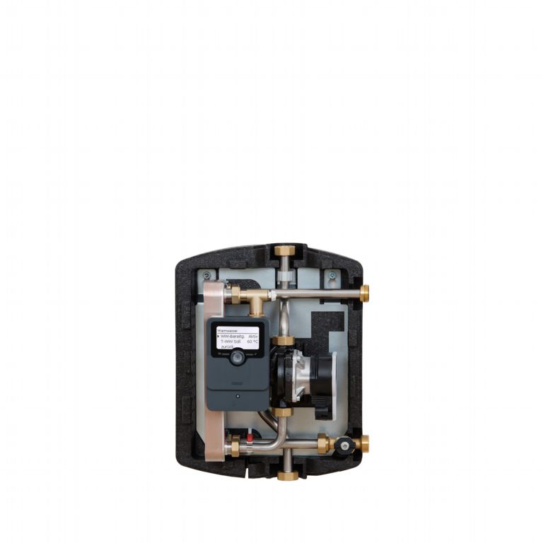 san-f30-e-san-f30-ve - Pleion Internal view of a compact heating system valve module with a small pump and copper tubing inside a foam enclosure/ housing.