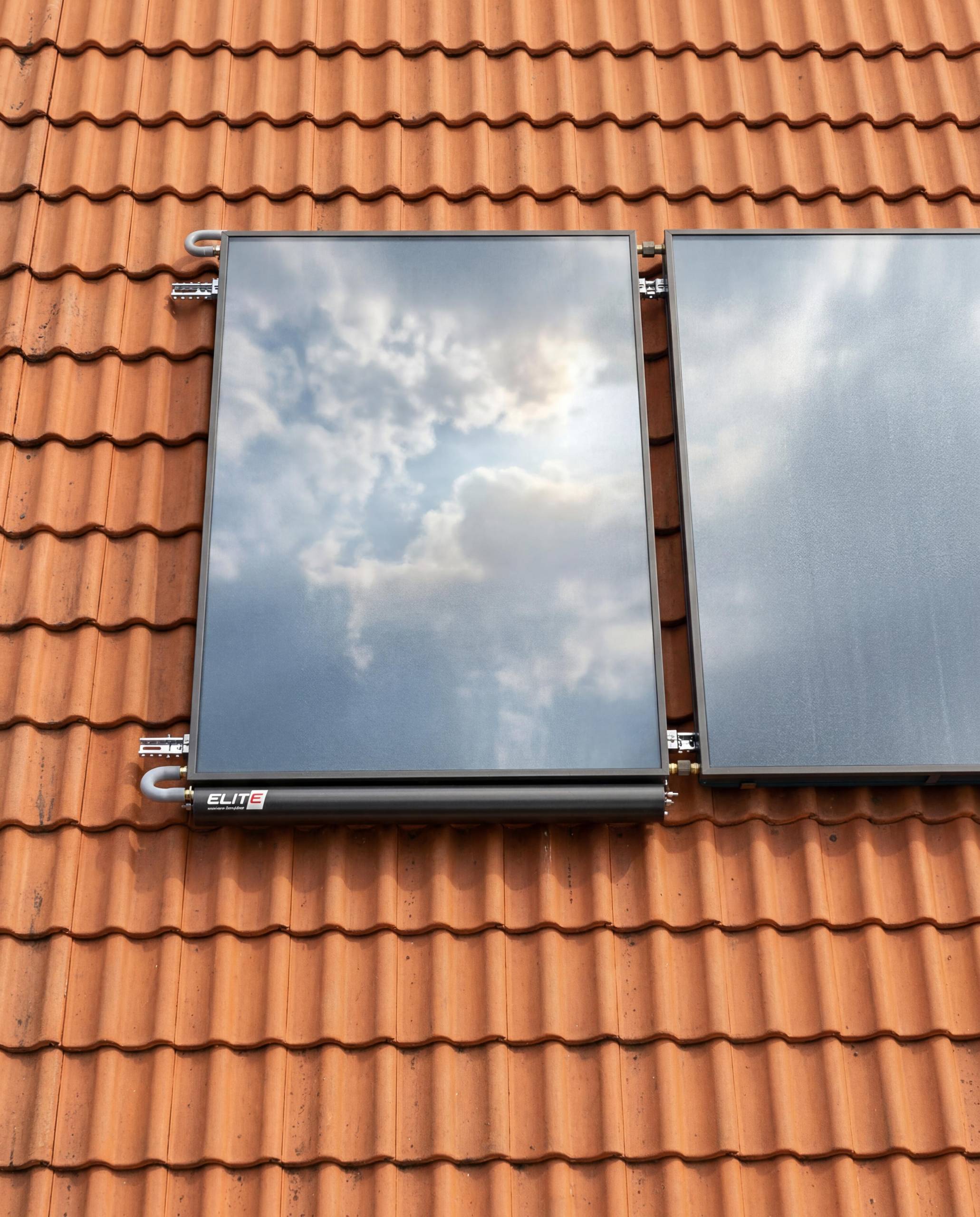 WhatsApp Image 2026-05-15 at 155639 1 - Pleion Solar thermal panel mounted on a red terracotta roof tiles with a metal frame.